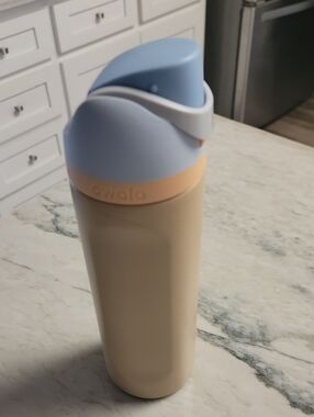 Owala Beige Travel Bottle with Light Blue Lid